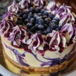 Indulge in Elegant White Chocolate Blueberry Swirl Cheesecake finished dish