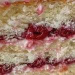 Indulge in Raspberry Filled Coconut Cake Bliss finished dish