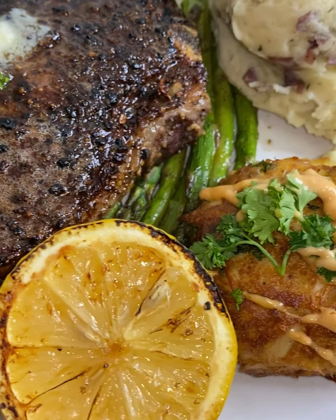 Indulge in Steak and Crab Cake Delight Tonight finished dish