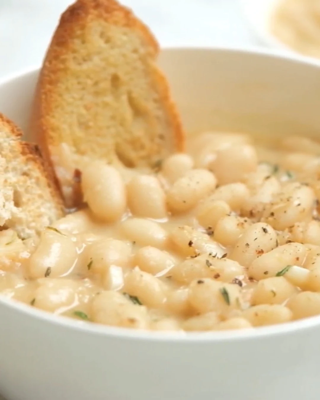 Irresistible Rosemary and Roasted Garlic White Bean Soup finished dish